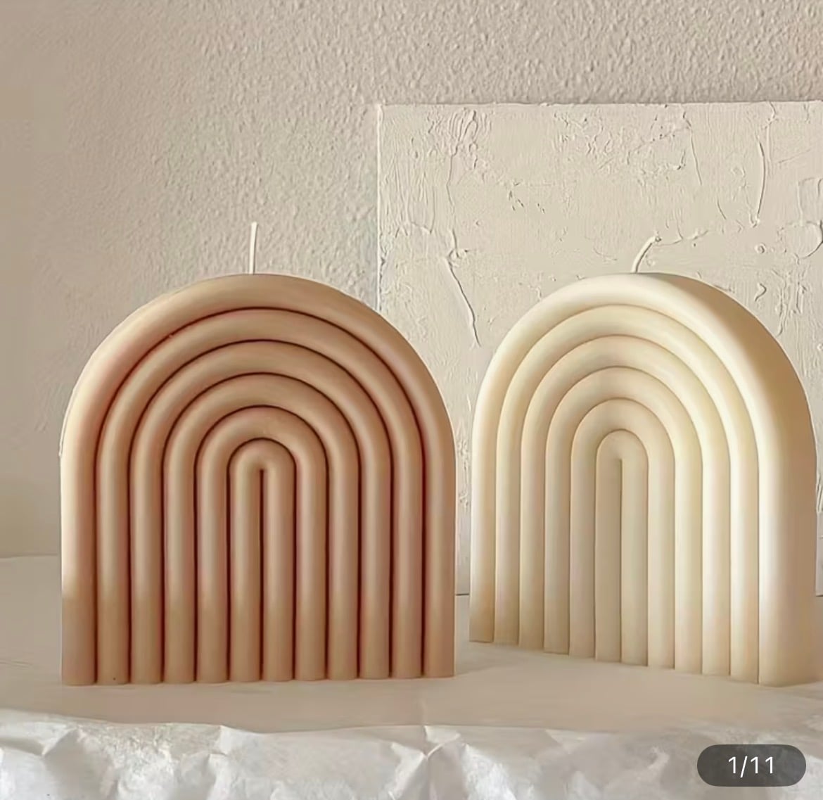Candle paired with a sculptural vase