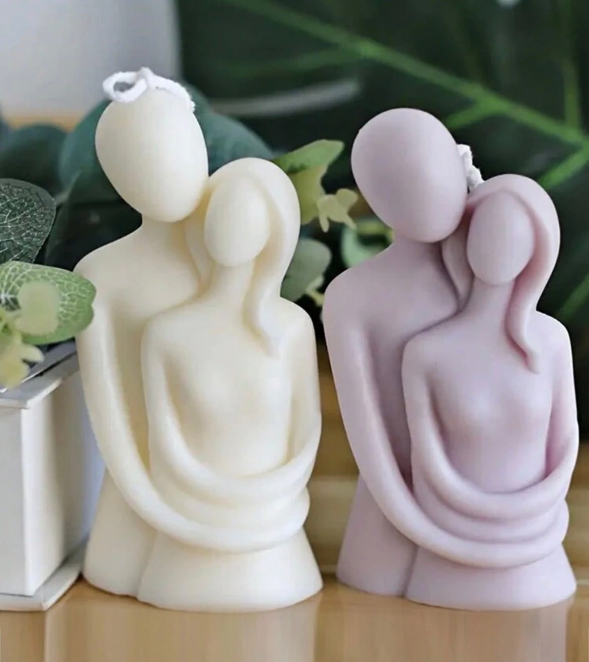 An embracing-couple candle paired with a heart dish