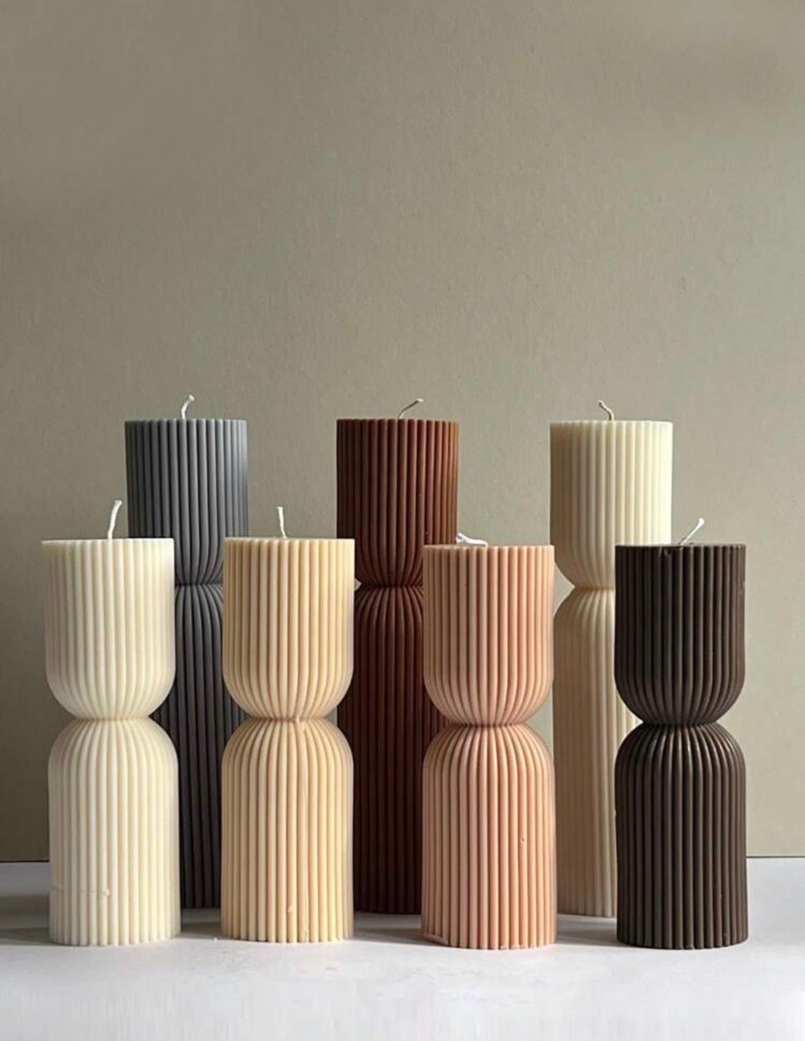 Fluted goblet pillar candles in a tonal range