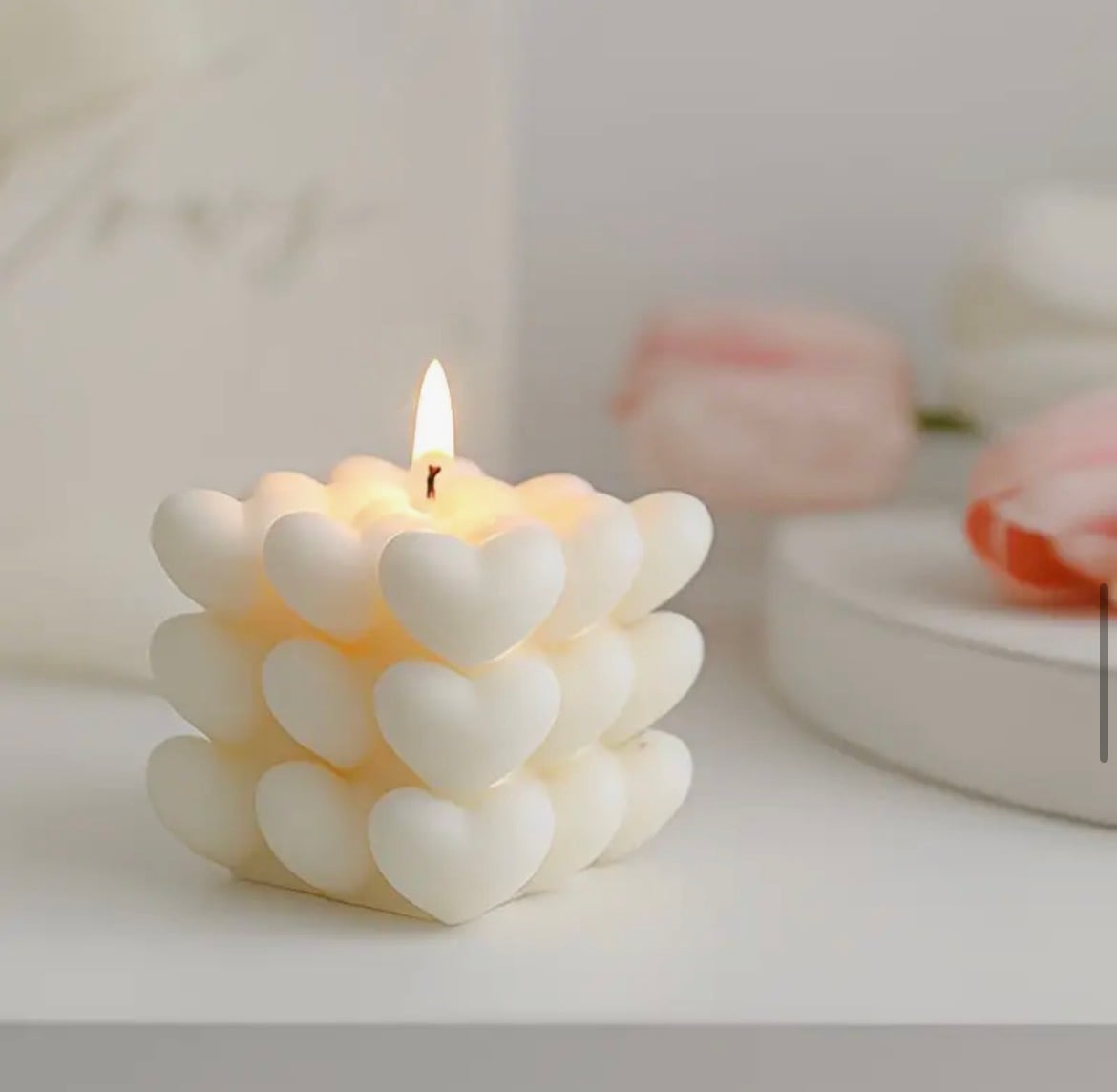 A cube of clustered heart shapes, lit