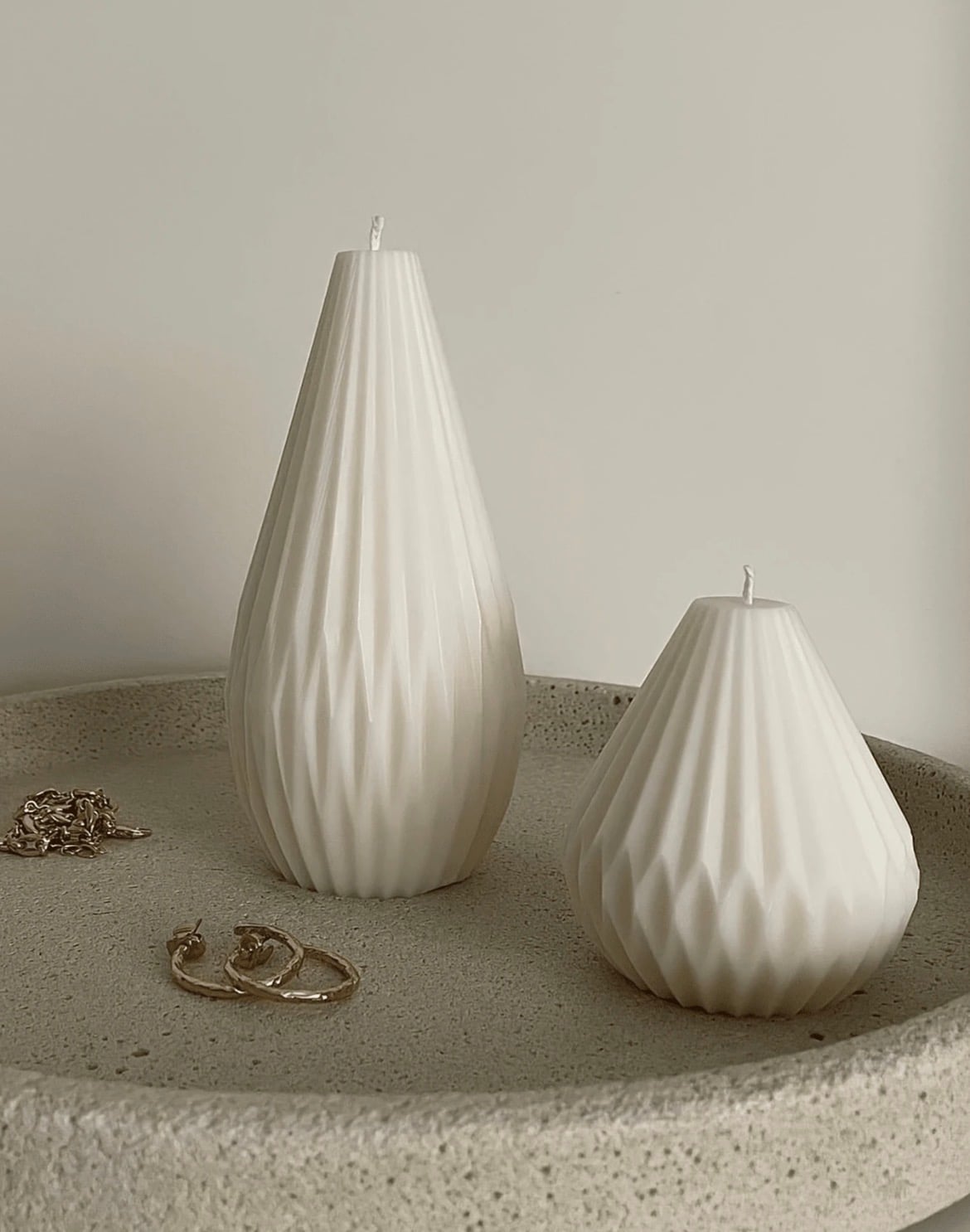 Candle in a blush-toned interior