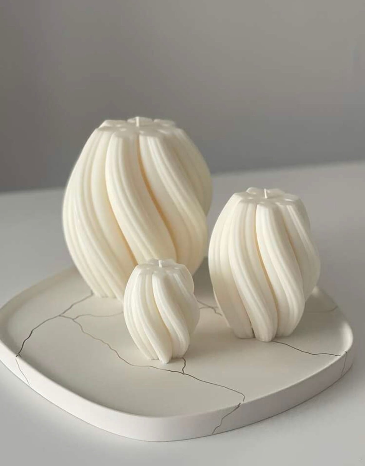 Twisted fluted orb candles in three sizes