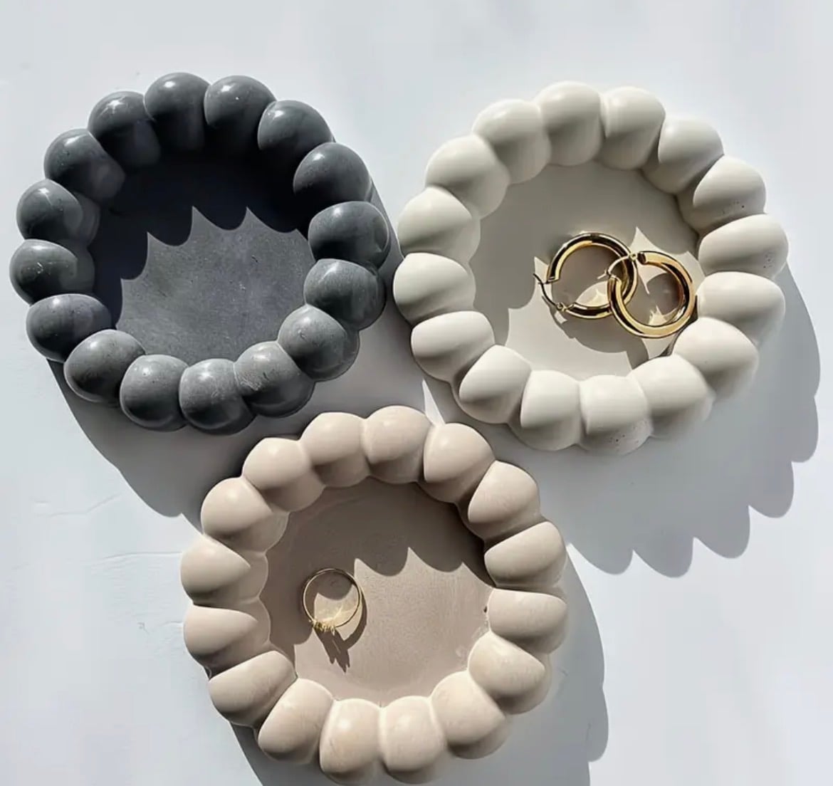 Bubble-rim plaster dishes in charcoal, cream and beige