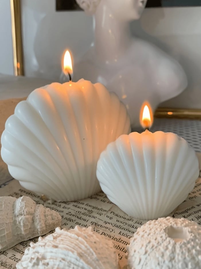Shell-formed candle in pale ivory