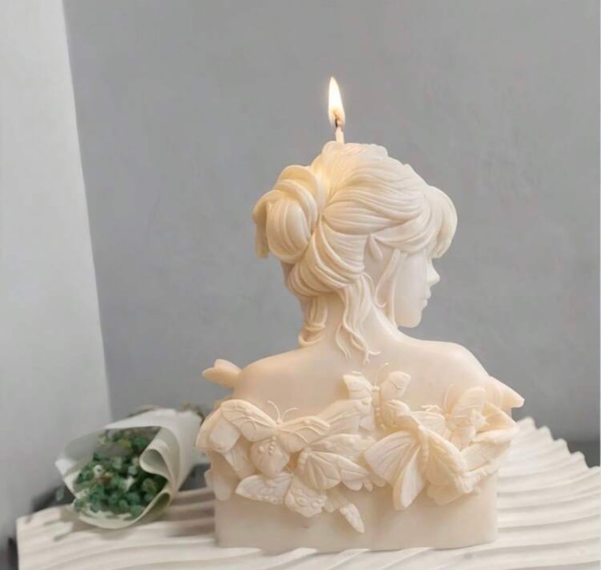 Butterfly bust candles in blush and cream, hand-poured in soy, beeswax and coconut wax