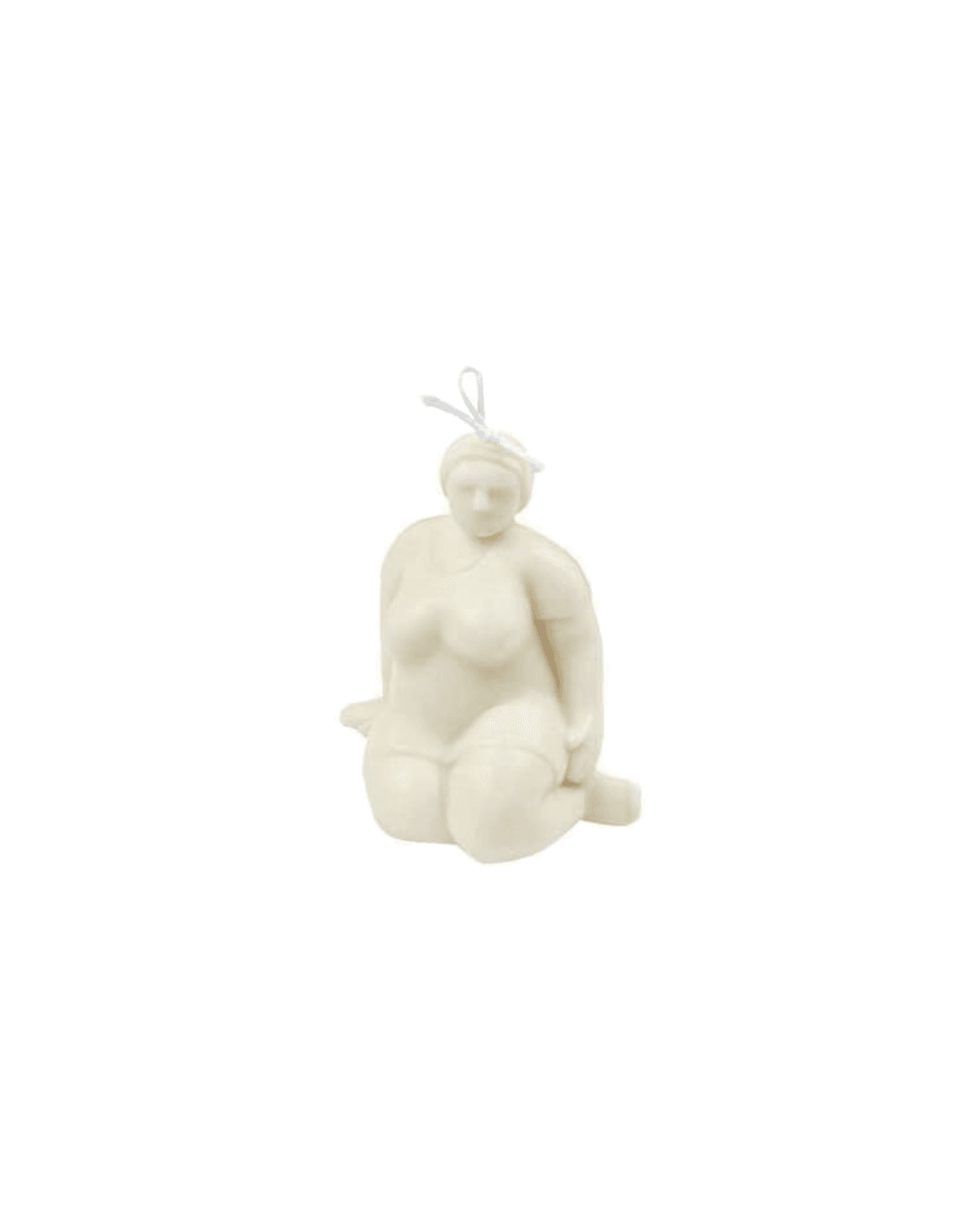 A seated Venus figure candle in cream