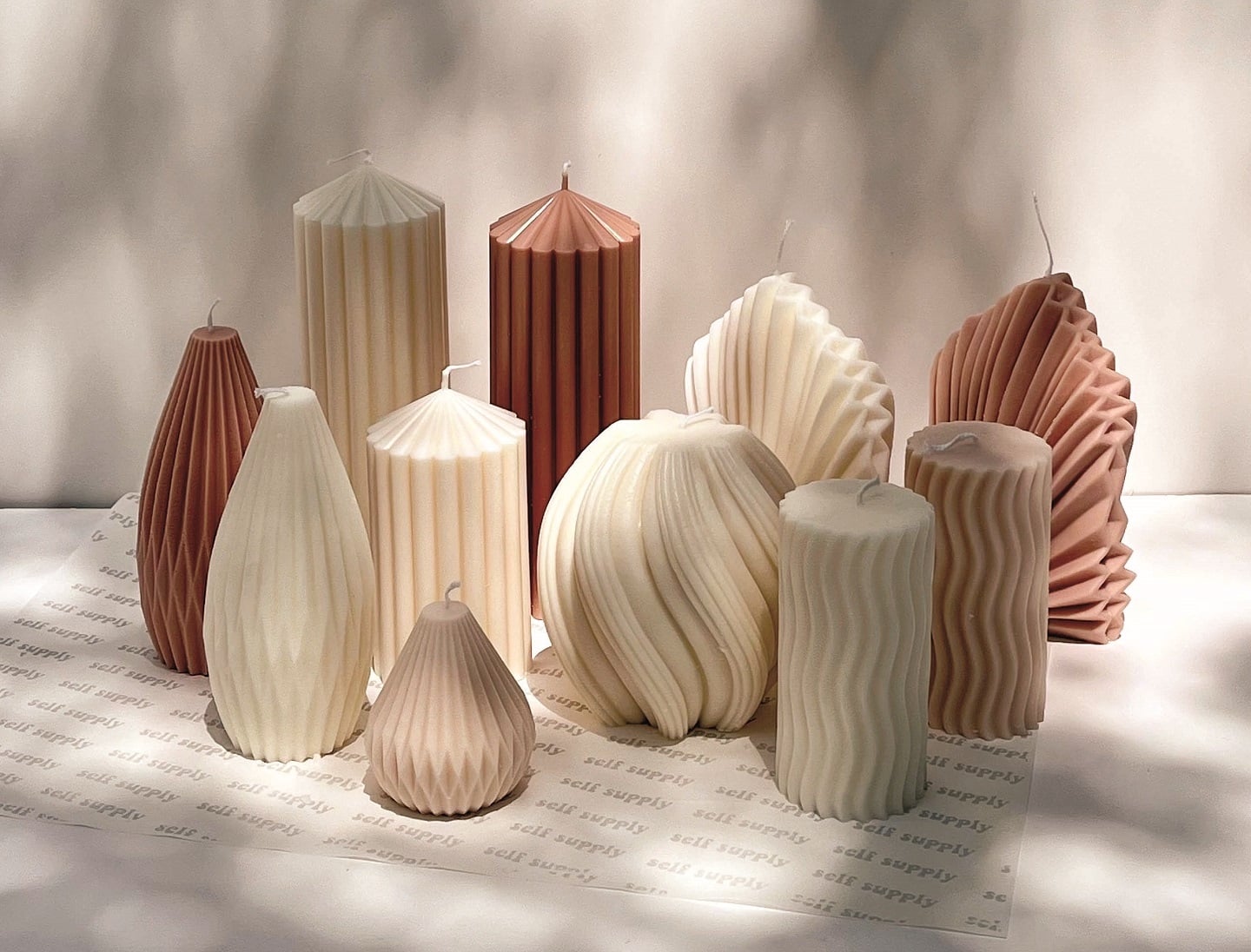 Hand-poured candles and cast plaster pieces made at an Éluvane workshop