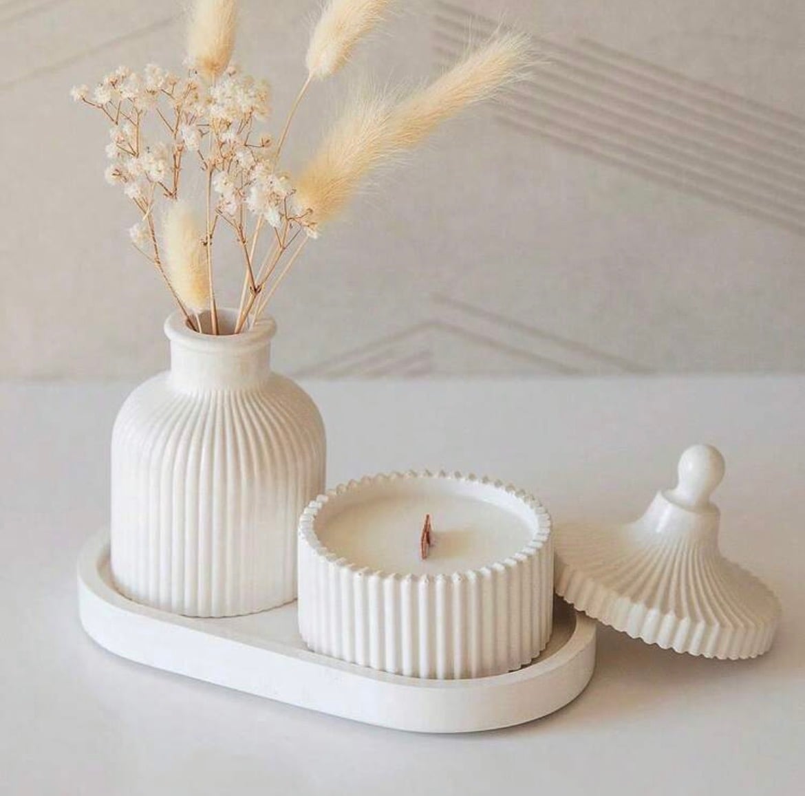 Fluted plaster vanity set: bottle vase, lidded vessel, and oval tray