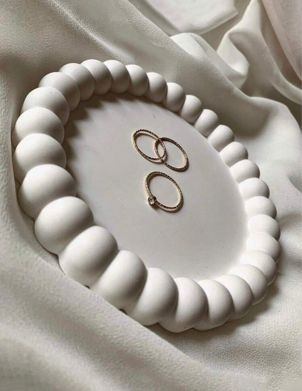 Oval ring dish with a beaded pearl edge in ivory plaster