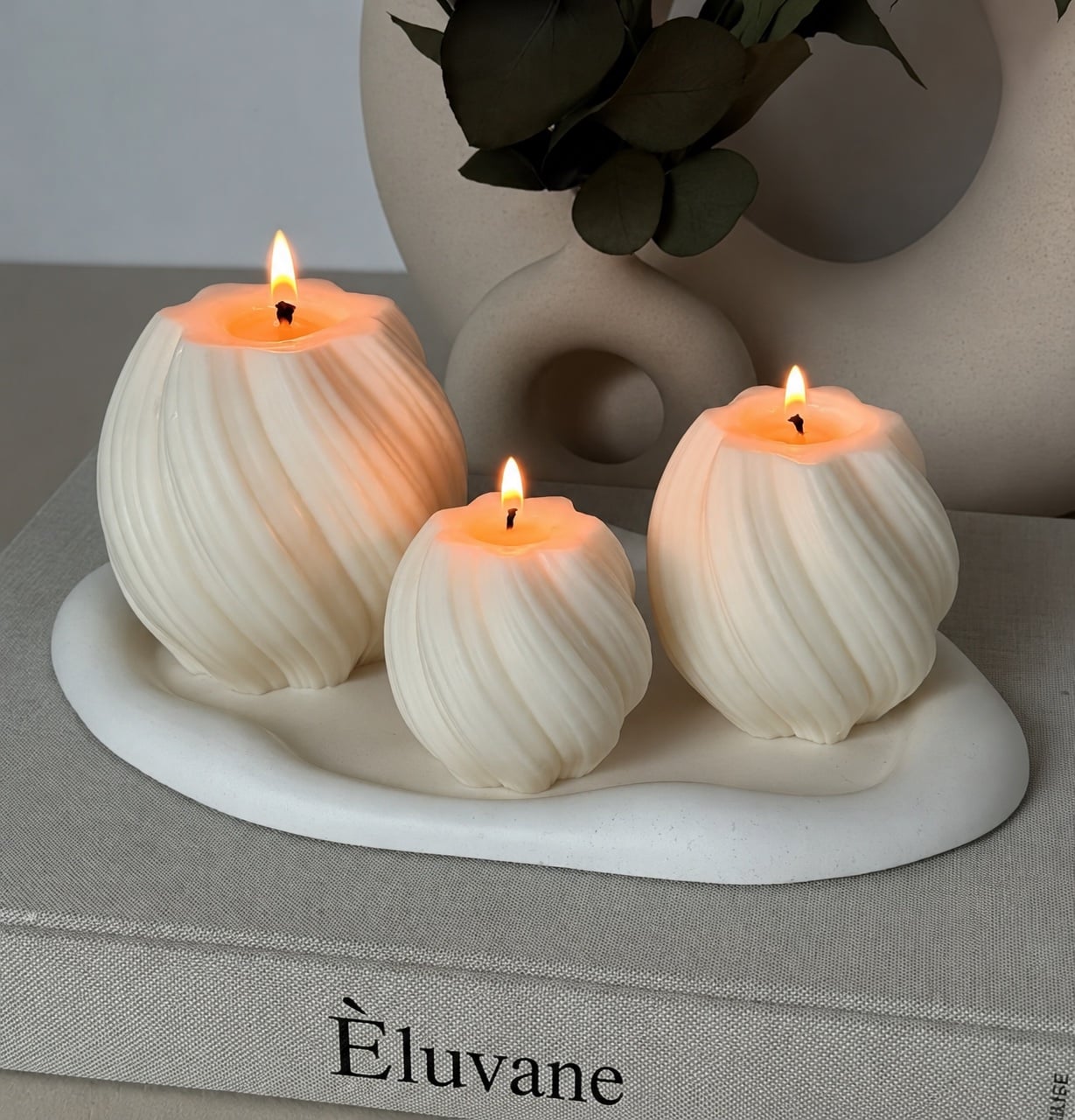 Twisted fluted orb candles in three sizes, hand-poured in soy wax