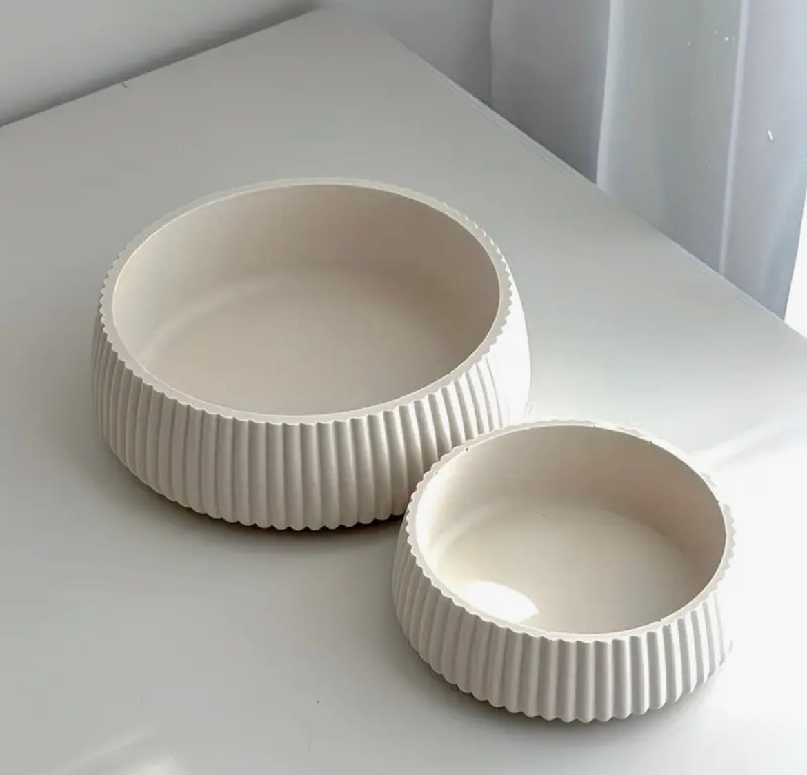 Fluted plaster bowl with a ribbed exterior