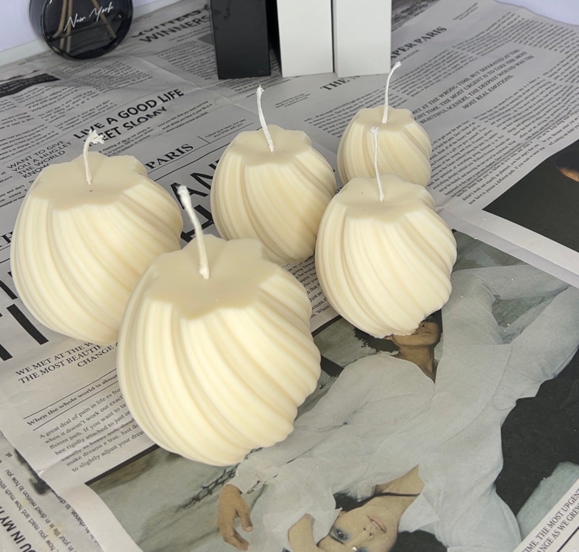 Twisted fluted orb candles in three sizes, hand-poured in soy, beeswax and coconut wax